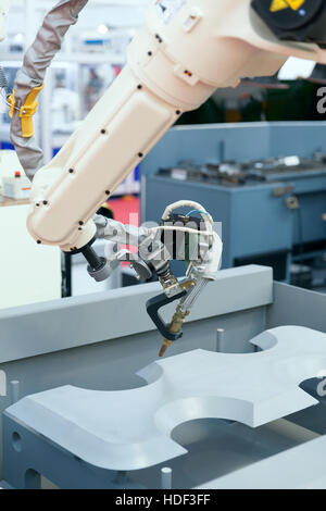 Industrial welding robotic arm Stock Photo