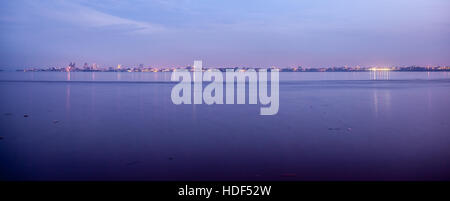 Kinshasa skyline. Photo taken from Brazzaville across Congo river at sunset. Panoramic photo suitable for travel web sites. Stock Photo