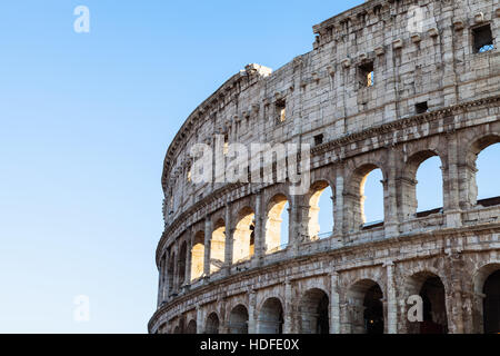 travel to Italy - walls of ancient roman amphitheatre Coliseum in Rome city in evening Stock Photo