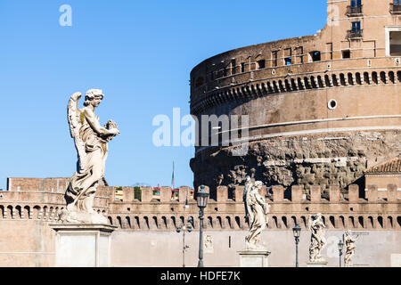 travel to Italy - statues of Angels on bridge Ponte Sant Angelo near the Castel in Rome city Stock Photo