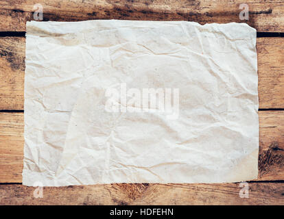 Old paper and poster vintage on wood background with space Stock Photo