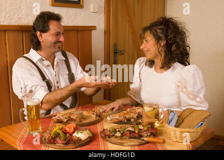 Brettljause, traditional Austrian snack served on a wooden board Stock Photo