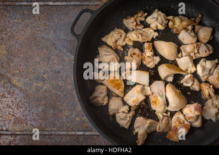 Fried chicken in the pan top view Stock Photo