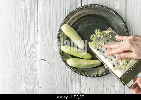 Grate cucumbers in the metal plate top view Stock Photo