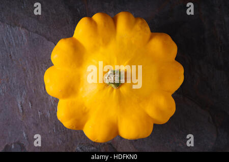 Yellow fresh squash patty pan on the dark stone background top view Stock Photo