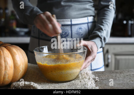 Mixing dough for pumpkin dump cake in the glass bowl horizontal Stock Photo