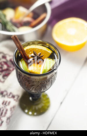Mulled wine with different spices in the green glass vertical Stock Photo