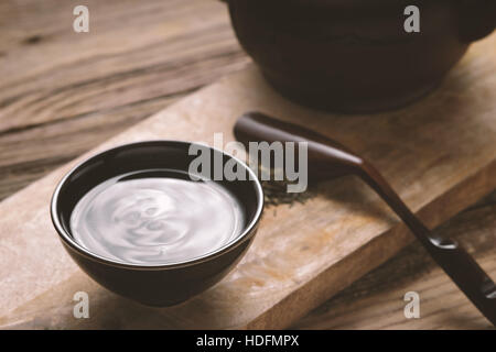 Chinese bowl with tea on the wooden table horizontal Stock Photo