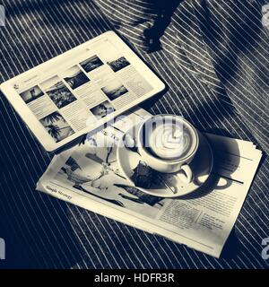 Coffee Americano Espresso Newspaper Couch Brownie Digital Tablet Concept Stock Photo