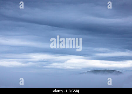 Mist and fog in Flintshire with fog over the Clwydian Range Hills that borders Flintshire and Denbighshire and spectacular cloud formations. Stock Photo