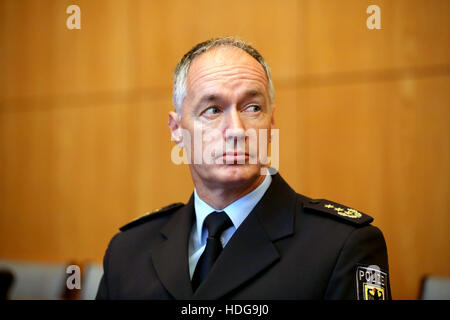 Cologne, Germany. 12th Dec, 2016. The head of the Federal Police directory, Wolfgang Wurm (L), follows the press conference regarding the preperations for New Year's Eve in Cologne, germany, 12 December 2016. Photo: Oliver Berg/dpa Credit:  dpa picture alliance/Alamy Live News Stock Photo