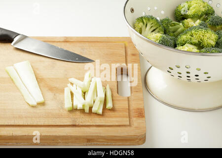 broccoli and stalk - preparing the broccoli stalk for cooking Stock Photo