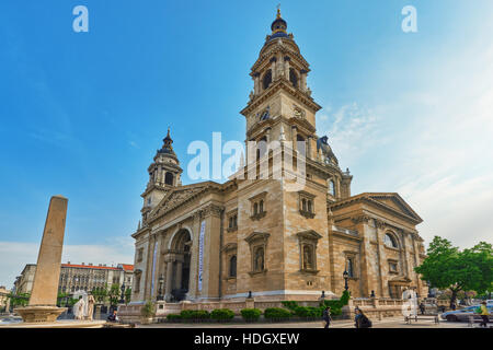 BUDAPEST, HUNGARY-MAY 04, 2016: St.Stephen Basilica in Budapest at daytime. Side View from street with car's and people. Hungary. Stock Photo