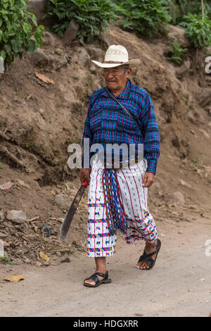 An older Mayan farmer wearing the traditional dress of San Pedro la ...