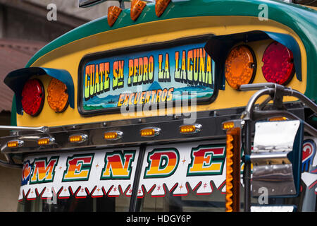 Detail photo of the front of a brightly painted public transport "chicken bus" in San Pedro la Laguna, Guatemala. Stock Photo
