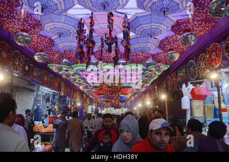 Lahore, Pakistan. 11th Dec, 2016. Pakistani devotee people decorating a market with colorful stuff on the celebration of Eid Milad-un-Nabi, the birthday of the Prophet Muhammad. The birth of the Prophet Mohammed is celebrated on on 12 Rabil ul Awal in the Muslim calendar. The birth of the Prophet Mohammed is celebrated on 12 Rabil ul Awal in the Muslim calendar Credit:  Rana Sajid Hussain/Pacific Press/Alamy Live News Stock Photo