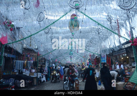 Lahore, Pakistan. 11th Dec, 2016. Pakistani devotee people decorating a market with colorful stuff on the celebration of Eid Milad-un-Nabi, the birthday of the Prophet Muhammad. The birth of the Prophet Mohammed is celebrated on on 12 Rabil ul Awal in the Muslim calendar. The birth of the Prophet Mohammed is celebrated on 12 Rabil ul Awal in the Muslim calendar Credit:  Rana Sajid Hussain/Pacific Press/Alamy Live News Stock Photo