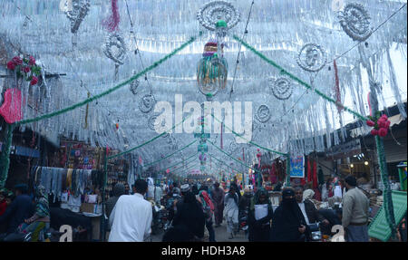 Lahore, Pakistan. 11th Dec, 2016. Pakistani devotee people decorating a market with colorful stuff on the celebration of Eid Milad-un-Nabi, the birthday of the Prophet Muhammad. The birth of the Prophet Mohammed is celebrated on on 12 Rabil ul Awal in the Muslim calendar. The birth of the Prophet Mohammed is celebrated on 12 Rabil ul Awal in the Muslim calendar Credit:  Rana Sajid Hussain/Pacific Press/Alamy Live News Stock Photo