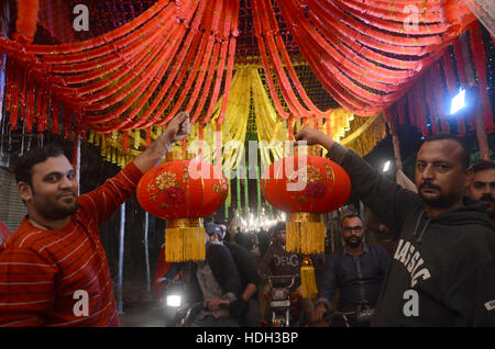 Lahore, Pakistan. 11th Dec, 2016. Pakistani devotee people decorating a market with colorful stuff on the celebration of Eid Milad-un-Nabi, the birthday of the Prophet Muhammad. The birth of the Prophet Mohammed is celebrated on on 12 Rabil ul Awal in the Muslim calendar. The birth of the Prophet Mohammed is celebrated on 12 Rabil ul Awal in the Muslim calendar Credit:  Rana Sajid Hussain/Pacific Press/Alamy Live News Stock Photo