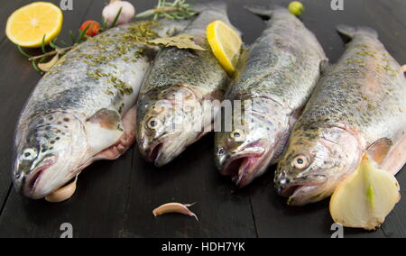 raw seasoned trout on a wooden table Stock Photo