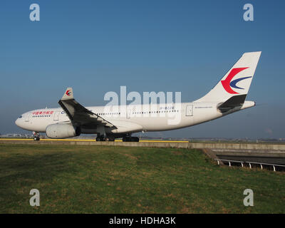 B-8226 is a China Eastern Airlines Airbus A330-243 aircraft, with construction number 1655, captured taxiing at Schiphol Airport, heading towards runway 36L. This wide-body aircraft is part of China Eastern's long-haul fleet, commonly used for international flights. Stock Photo