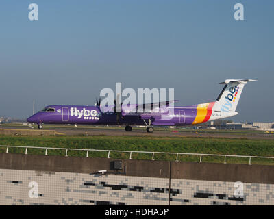 G-JECG Flybe De Havilland Canada DHC-8-402Q Dash 8 - cn 4098 at Schiphol taxiing towards runway 36L Stock Photo