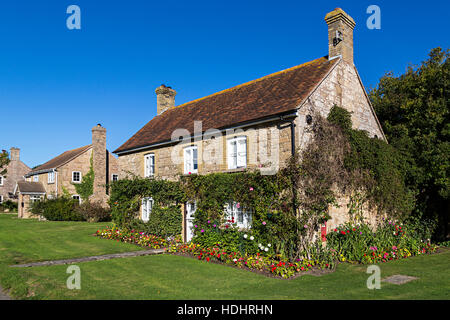 Houses with flowerbed, Newtown Harbour NNR, Isle of Wight, UK Stock Photo