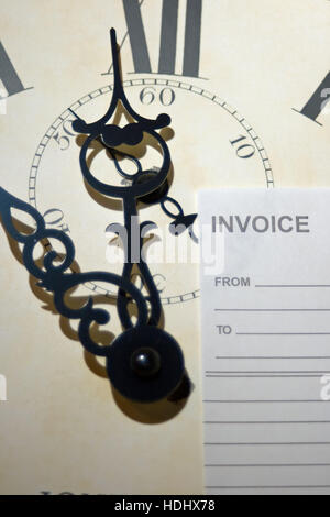 clock face and blank invoice. Concept of "time is money". Stock Photo