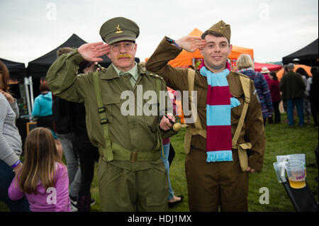 Audience members wearing fancy dress at the 2016 Big Tribute music festival, on the outskirts of Aberystwyth Wales UK,  held every year on the August Bank Holiday weekend,. Stock Photo