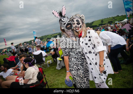 Audience members wearing fancy dress at the 2016 Big Tribute music festival, on the outskirts of Aberystwyth Wales UK,  held every year on the August Bank Holiday weekend,. Stock Photo