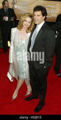 Sharon Lawrence and husband, Tom Apostle,  arrives at the Screen Actors Guild Awards in Los Angeles, California on February 22, 2004.  Photo credit: Francis Specker Stock Photo