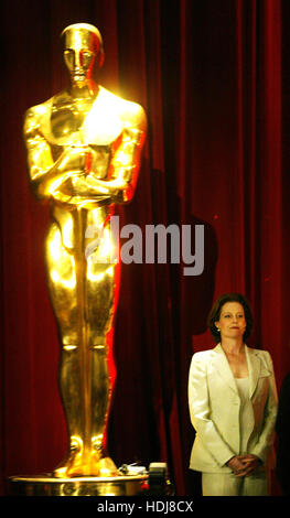 Actress Sigourney Weaver stands by a large replica of the Academy Award before announcing  the nominations for the 76th Annual Academy Awards at a news conference in Beverly Hills, California on Tuesday 27 January 2004. Photo credit: Francis Specker Stock Photo