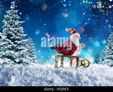 Puppet Santa Claus on snow Stock Photo