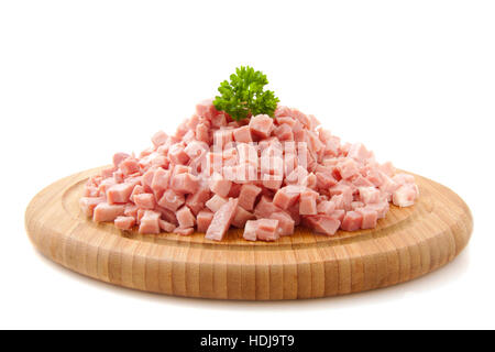 Pieces of chopped ham on wooden plate isolated over white Stock Photo