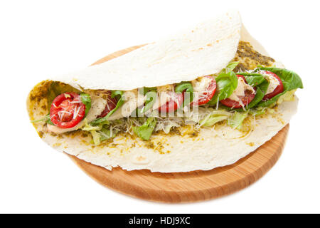 Delicious italian wrap on wooden plate isolated over white Stock Photo