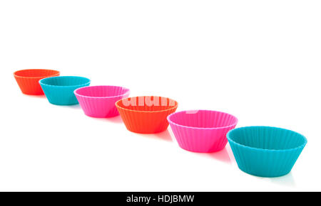 Six colorful cups in a row isolated over white Stock Photo