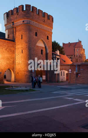 Bridge Gate (Brama Mostowa) at evening in city of Torun, Poland, Old Town fortification Stock Photo