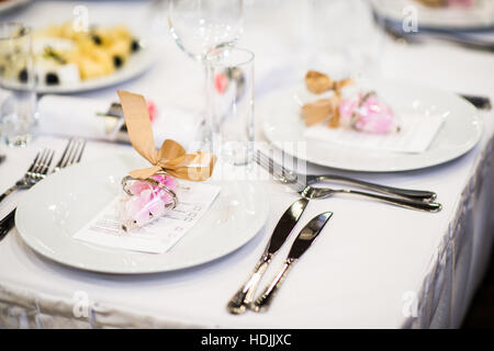 Beautiful restaurant setting on table for wedding celebration Stock Photo