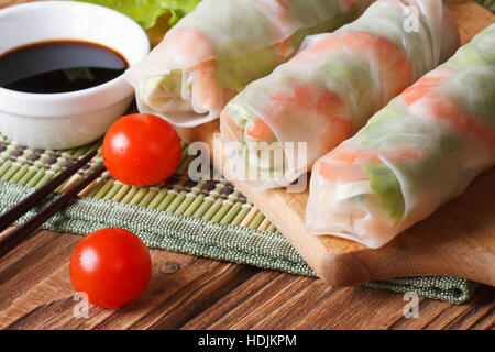Korean spring rolls with shrimp and sauce close up on the table. horizontal Stock Photo