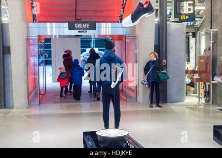 Customers crowd the new Adidas flagship store on Fifth Avenue in New York on Sunday, December 11, 2016. At 45,000 square feet the store is Adidas' largest. Nike, the world's largest manufacturer of athletic gear and apparel is losing ground as competitors Adidas and Upstart Under Armour continue to gain market share. (© Richard B. Levine) Stock Photo