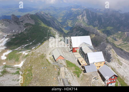 Looking down on a homestead as seen from the peak of Switzerland's Säntis Mountain in the Swiss Alps. Stock Photo