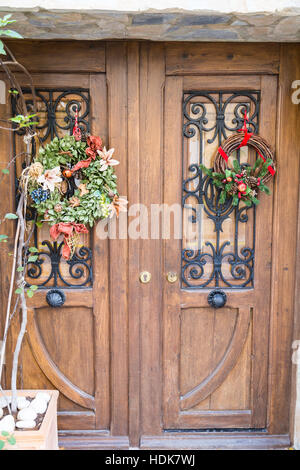 Polop, Alicante Province, Spain Christmas wreaths on wooden doors Stock Photo