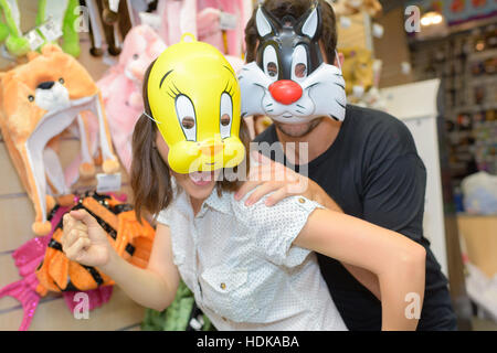 Man and woman in animal masks Stock Photo