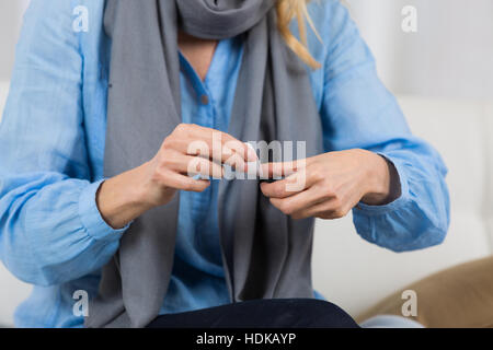 woman pouring body lotion on hand Stock Photo