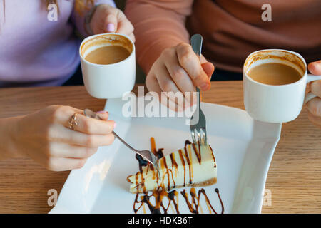 hands of woman and a man in cafe Stock Photo