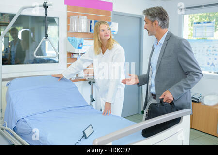 Man looking at adjustable bed Stock Photo