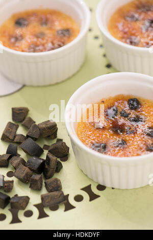 Creme brulee. Sweet french dessert served with liquorice in bowl.