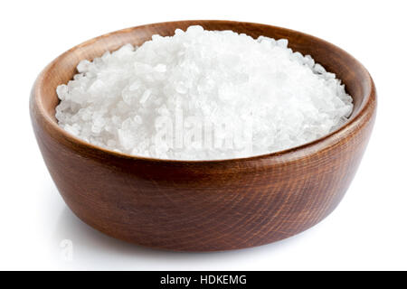 Coarse salt in wooden dish isolated on white. Stock Photo