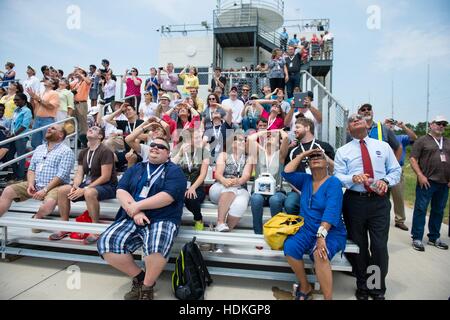 NASA Administrator Charles Bolden (right), wife Alexis Walker, and guests watch the Orbital Sciences Corporation Antares rocket and Cygnus cargo spacecraft Orbital-2 mission launch at the Wallops Flight Facility July 13, 2014 in Chincoteague Island, Virginia. Stock Photo