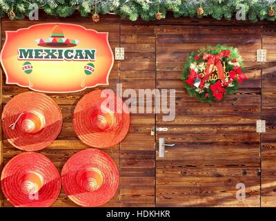 Mexican hat decoration on wooden wall at Christmas Stock Photo